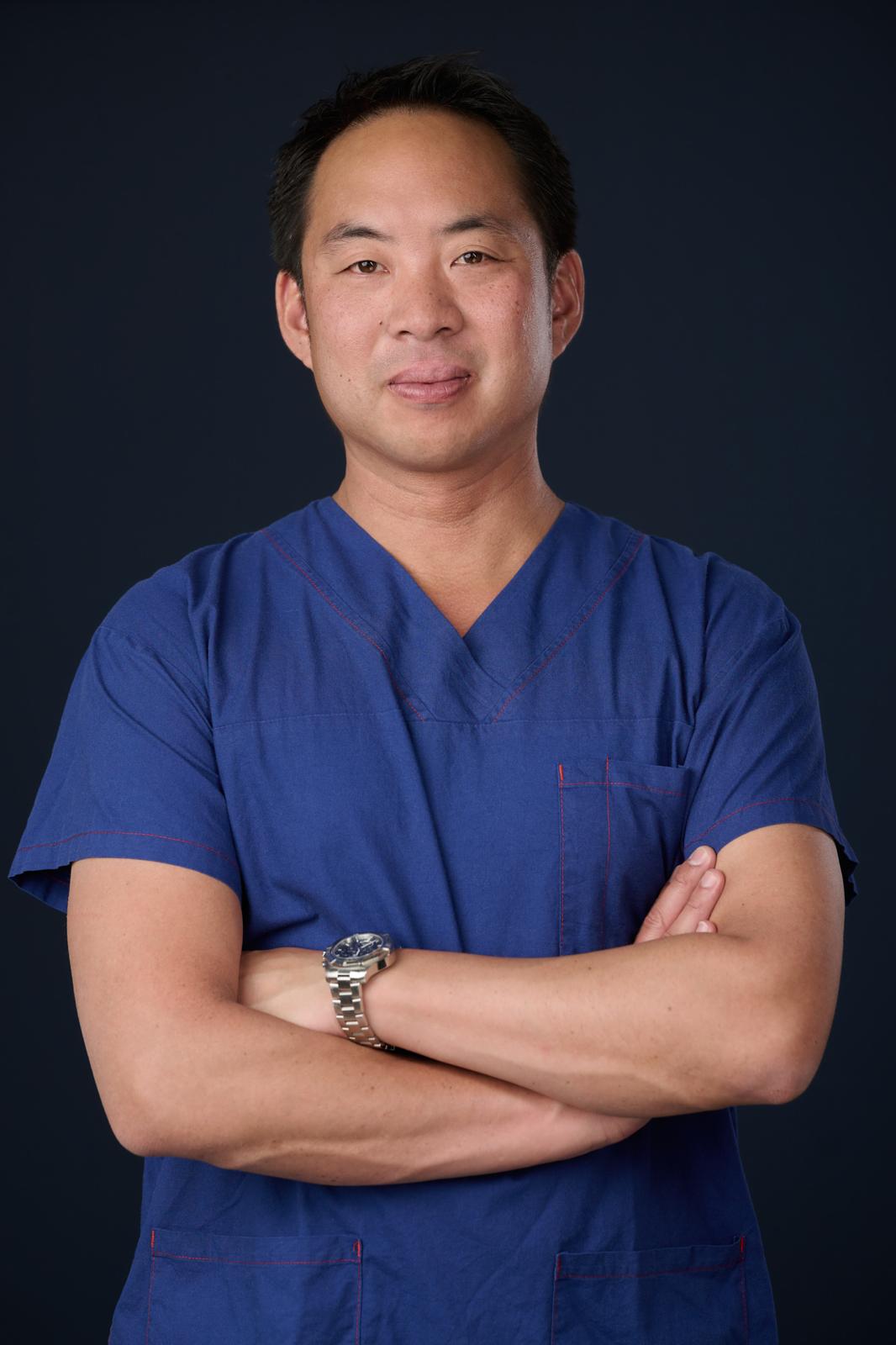 Dr Thomas Tiang in surgical attire